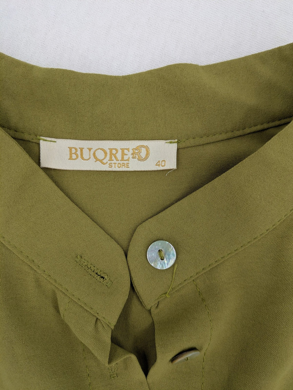 Buqre Store khaki A-line dress with puff sleeves, ruffled cuffs, and button placket.