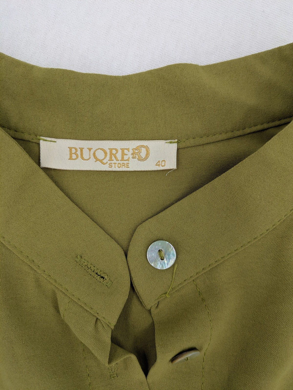 Buqre Store khaki A-line dress with puff sleeves, ruffled cuffs, and button placket.