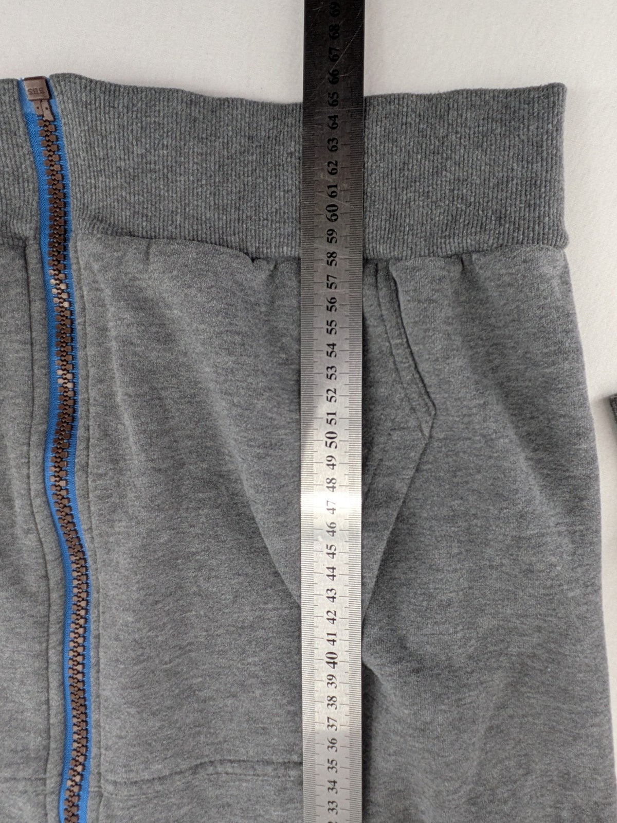 ALIFE turtle neck jumper blue grey colorblock design with logo details and soft cotton blend.