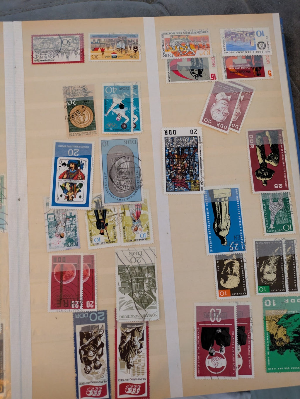 Beige postage stamp album featuring over 1000 stamps from Germany and Europe.