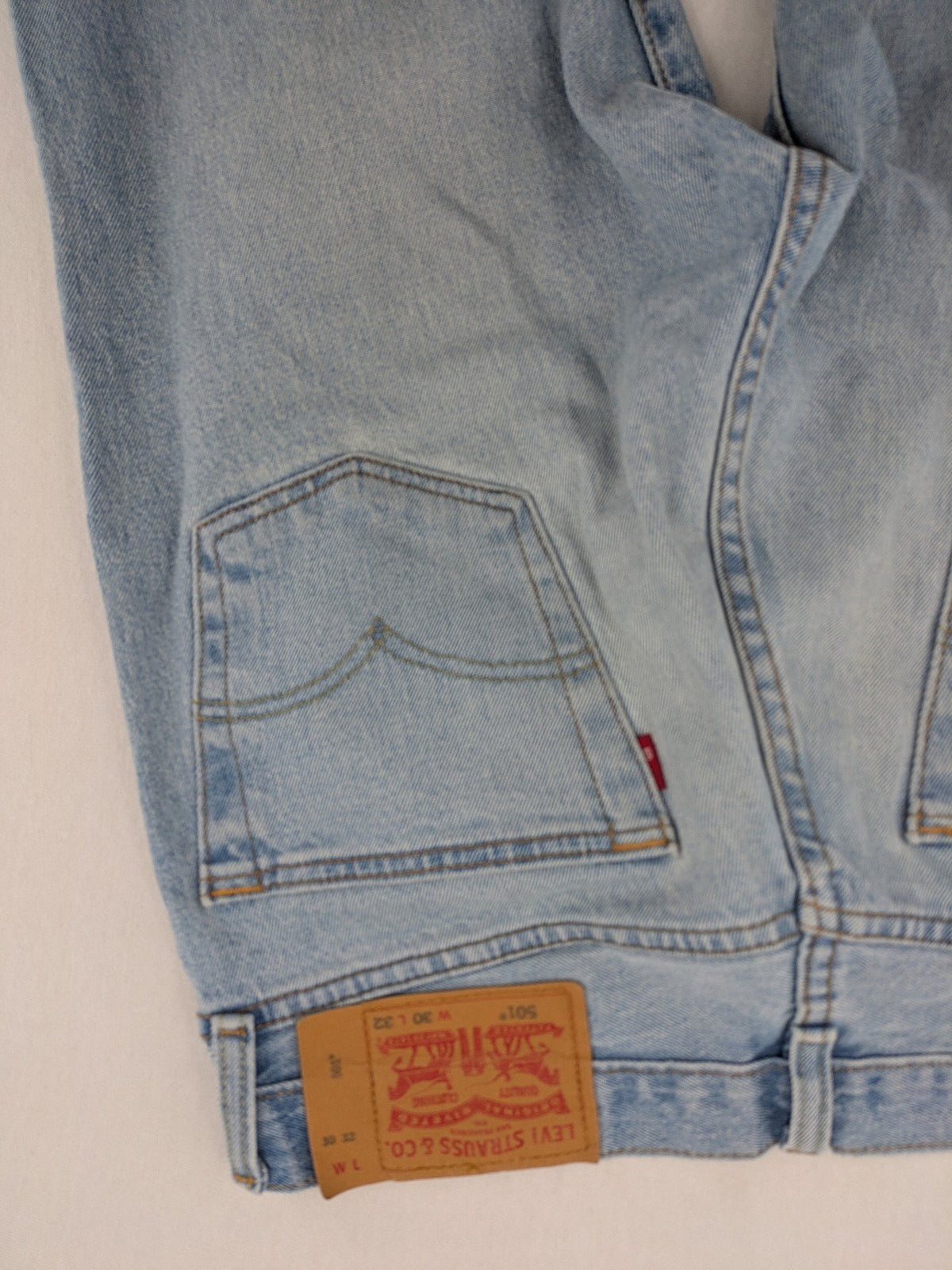 Levi's blue straight jeans light wash denim with button fly and classic fit.