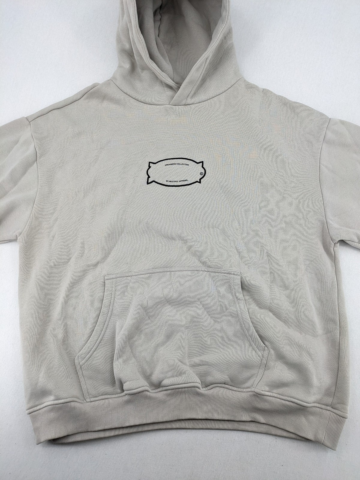 Multiply grey zip-through hoodie with embroidered logo and large "MLTPLY" print on back.