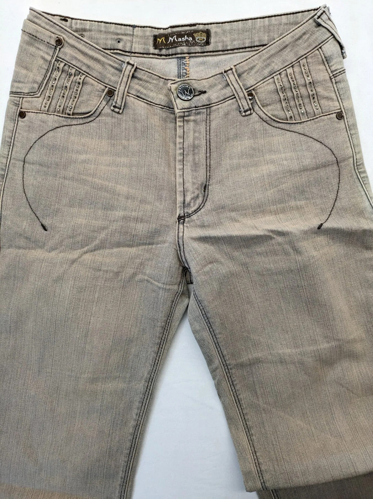 Masha khaki straight jeans with rhinestone embellishments and decorative stitching.