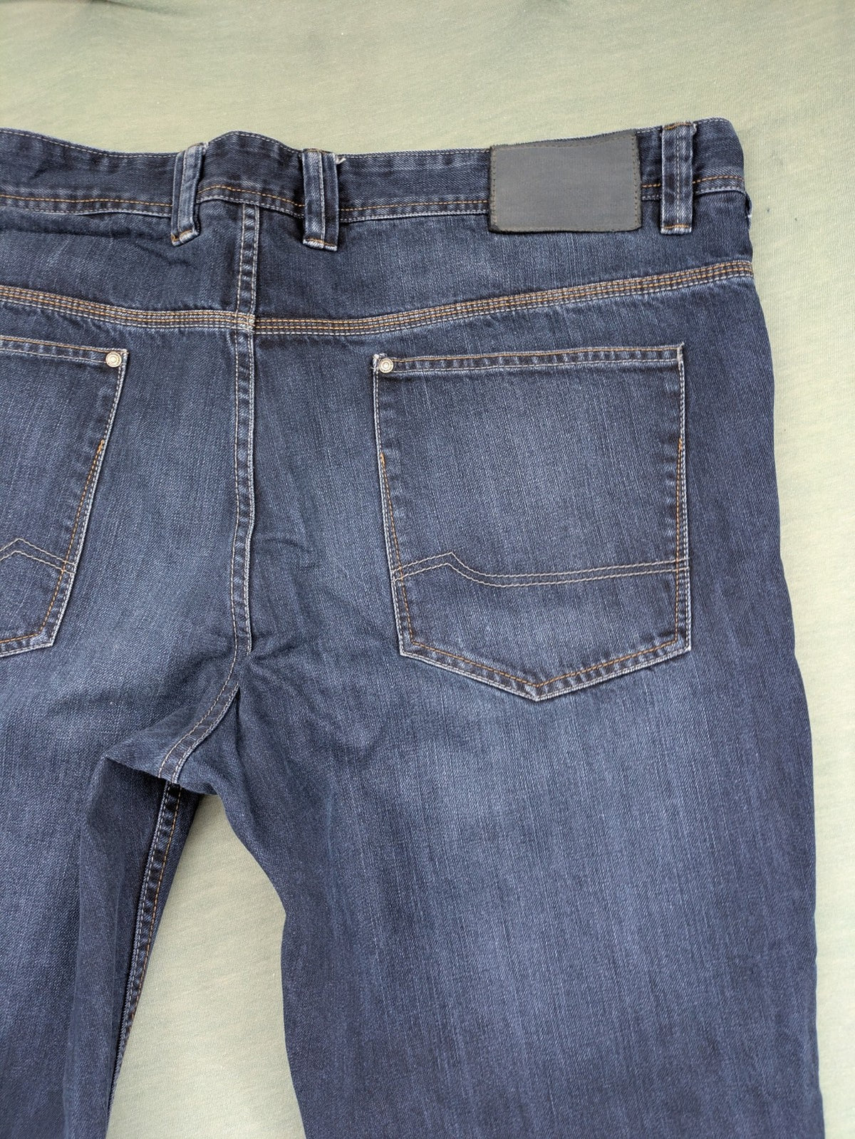 Canda blue straight jeans with five-pocket design and dark wash denim.