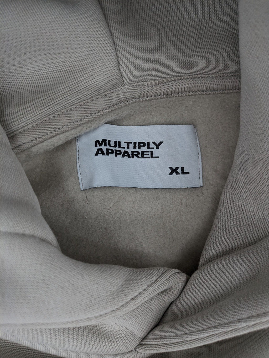 Multiply grey zip-through hoodie with embroidered logo and large "MLTPLY" print on back.