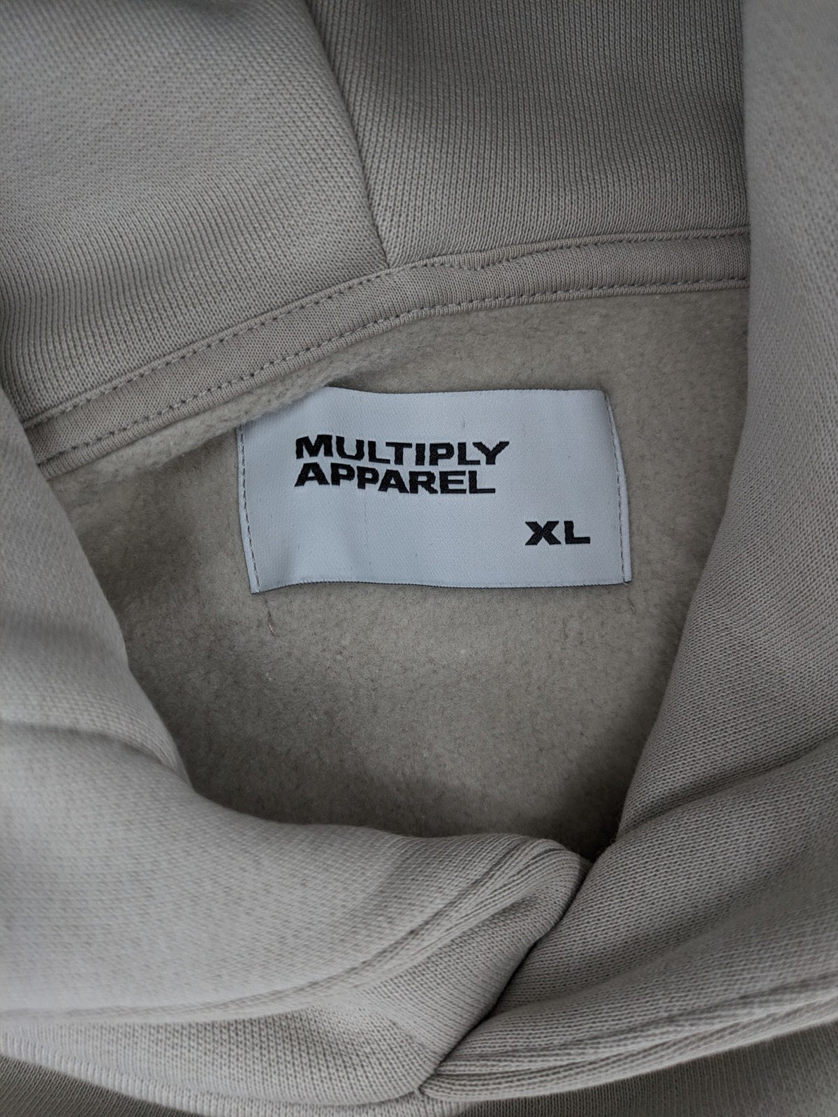 Multiply grey zip-through hoodie with embroidered logo and large "MLTPLY" print on back.