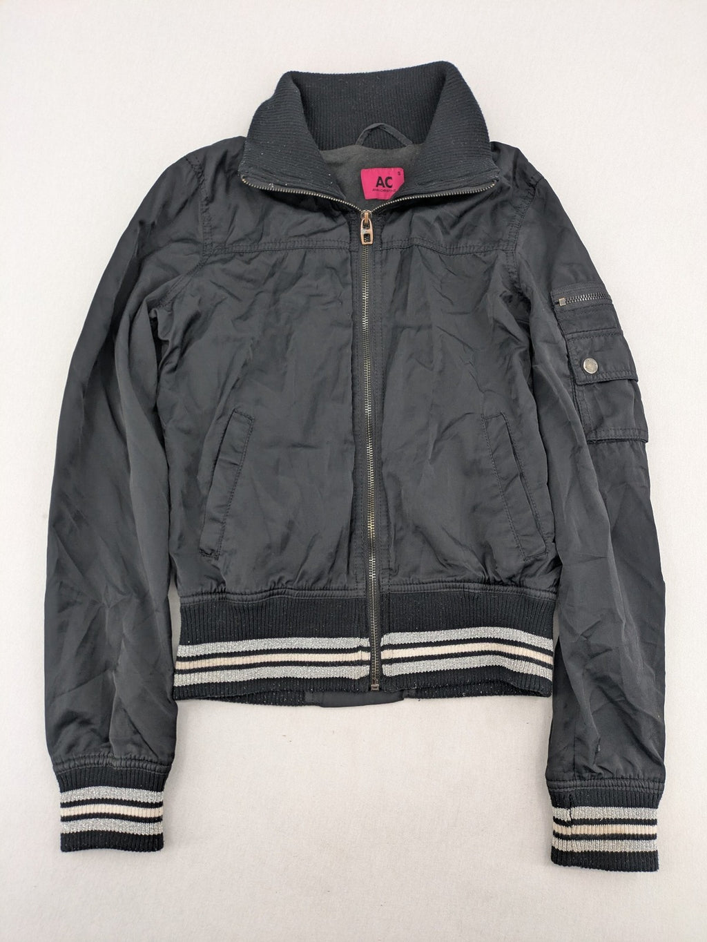 Ann Christine black bomber jacket with striped ribbed collar and cuffs, zip closure.
