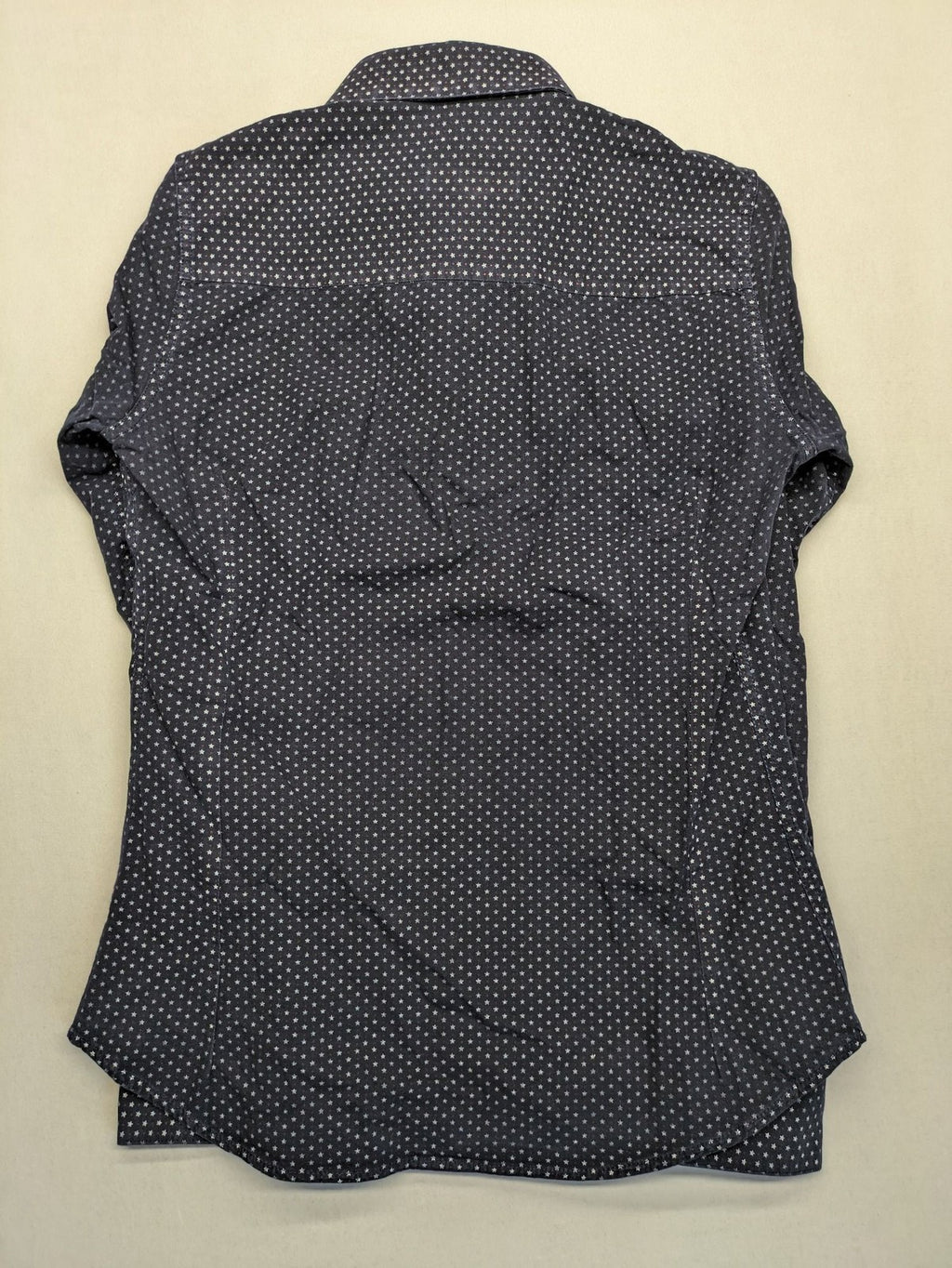 Tommy Hilfiger navy button-down shirt with white star pattern and embroidered flag logo.