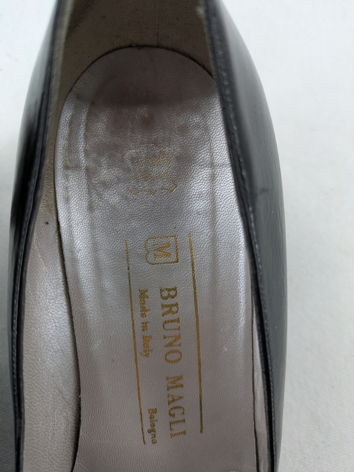 Bruno Magli black high heels leather with grey bow detail and classic silhouette.