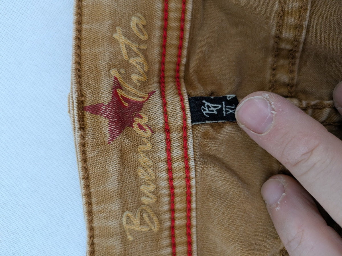 Buena Vista beige capri jeans with frayed hem and button fly detail.