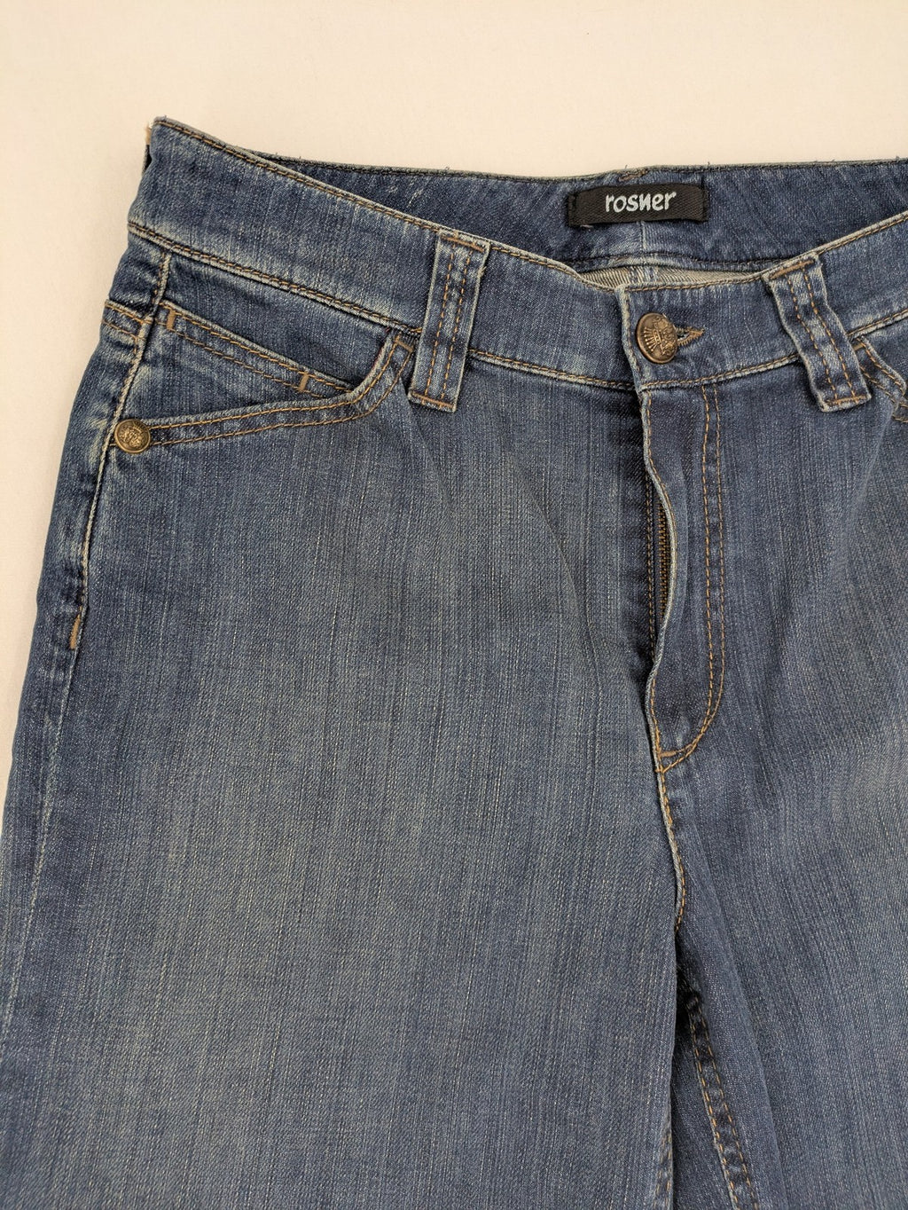 Rosner blue wide leg jeans with colorful embroidery on back pockets.