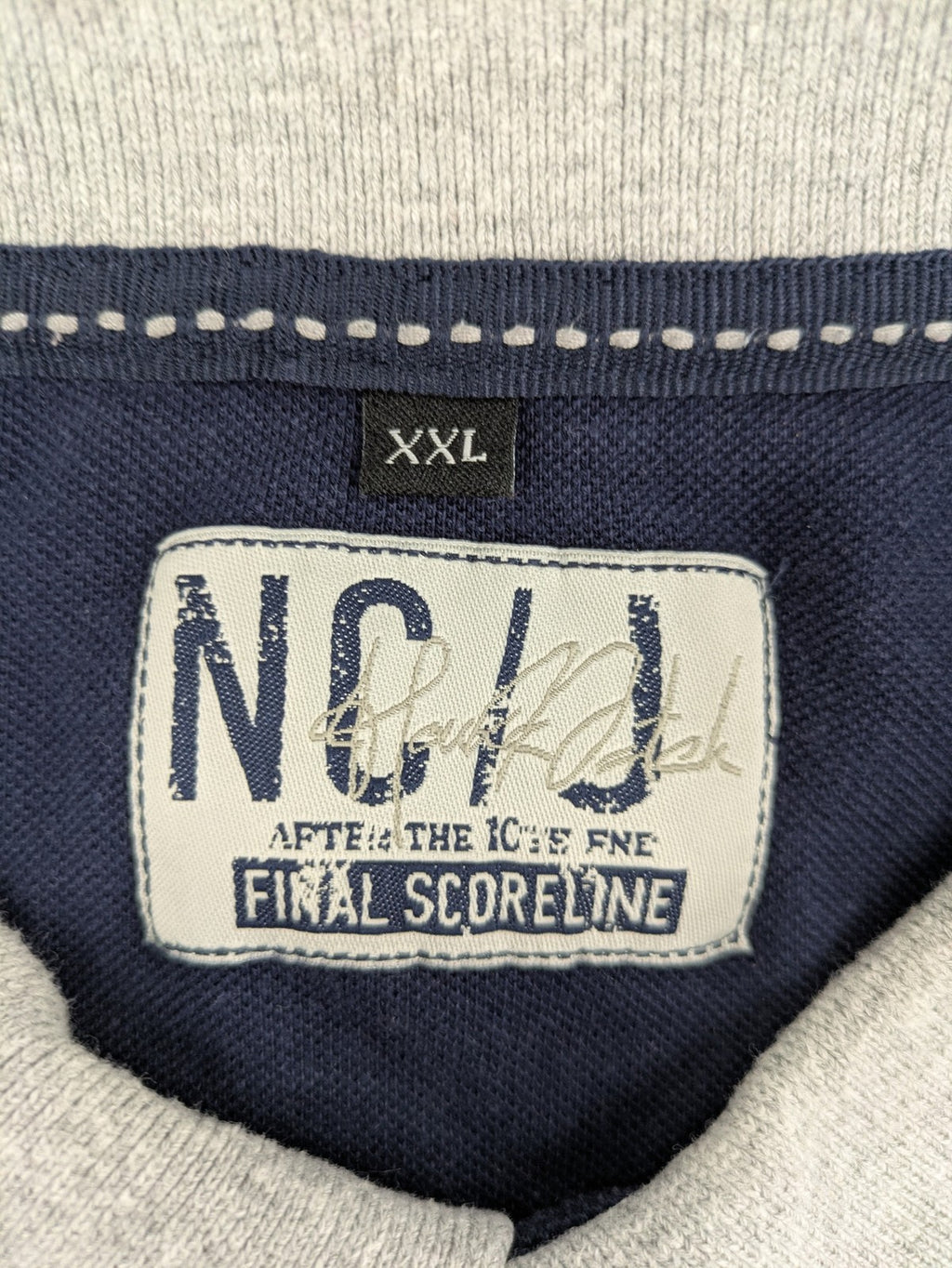 XXL navy polo shirt with grey contrast collar and cuffs, 100% cotton material.