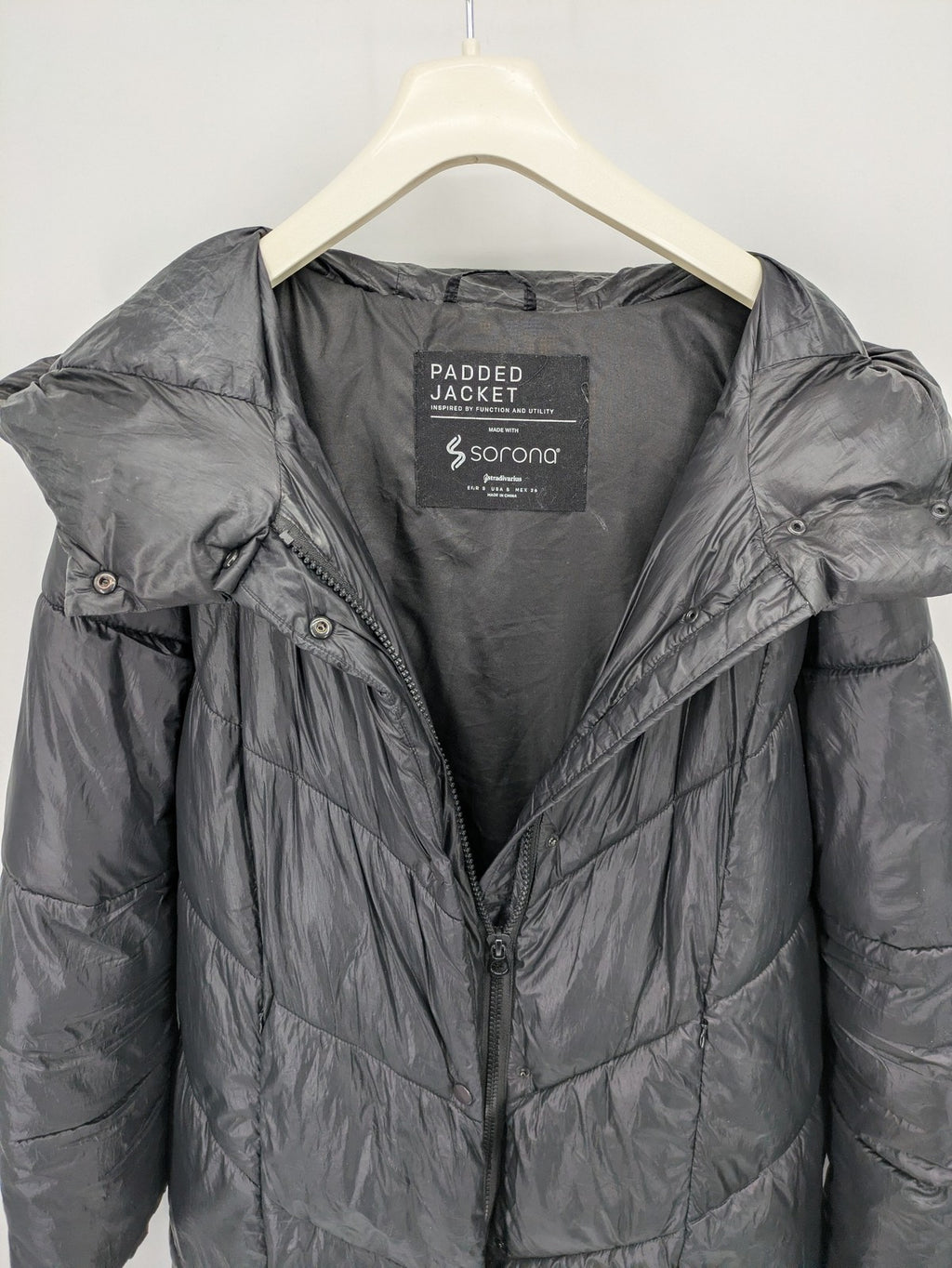 Stradivarius grey coat with chevron quilted pattern and hood, featuring zip closure and snap storm flap.