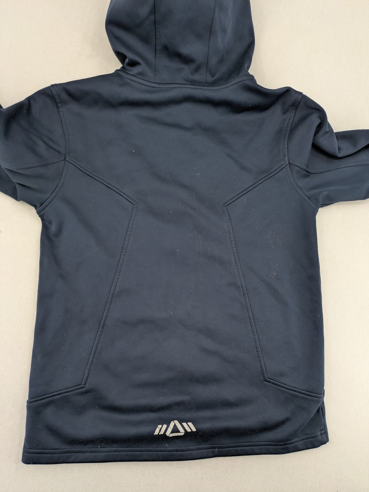 Crane navy softshell jacket with fleece lining, full zip, orange accent zippers.