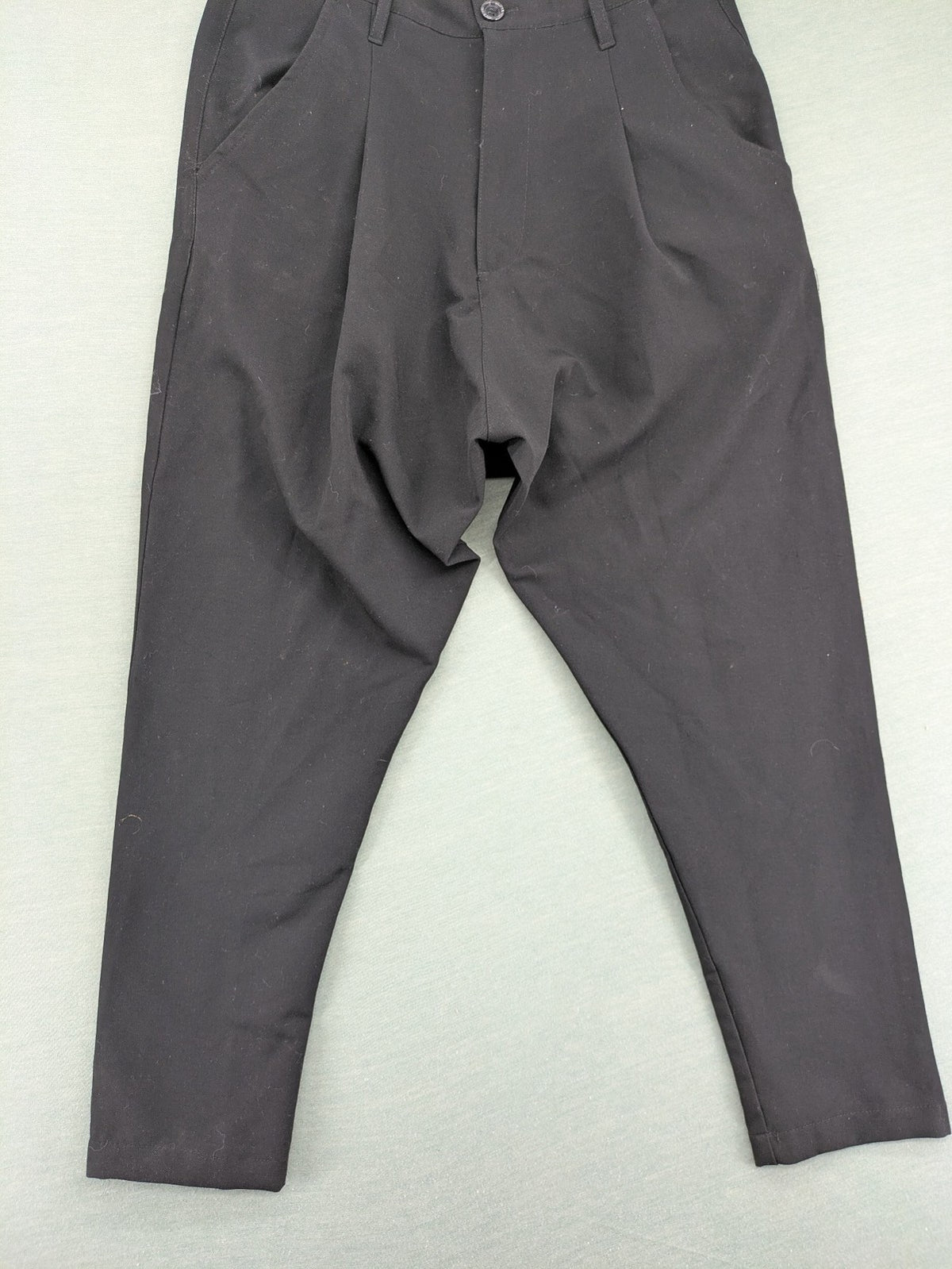 Jenny Joy pink harem pants with pleats, side pockets, and tapered legs.