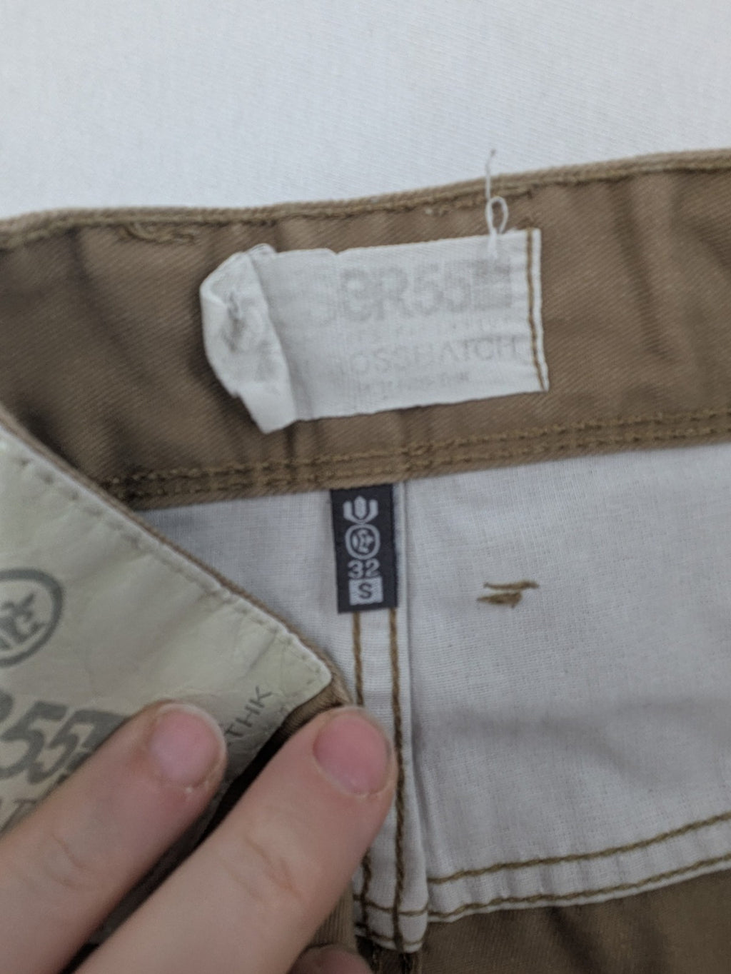 Crosshatch grey cargo pants with multiple pockets and durable cotton-polyester blend.