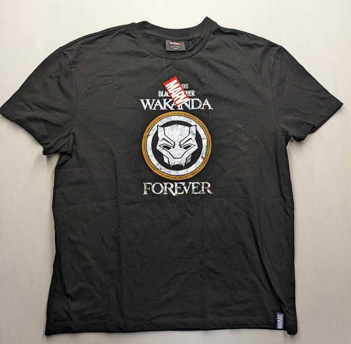 Black Panther black t-shirt foil graphic of Black Panther emblem and text.