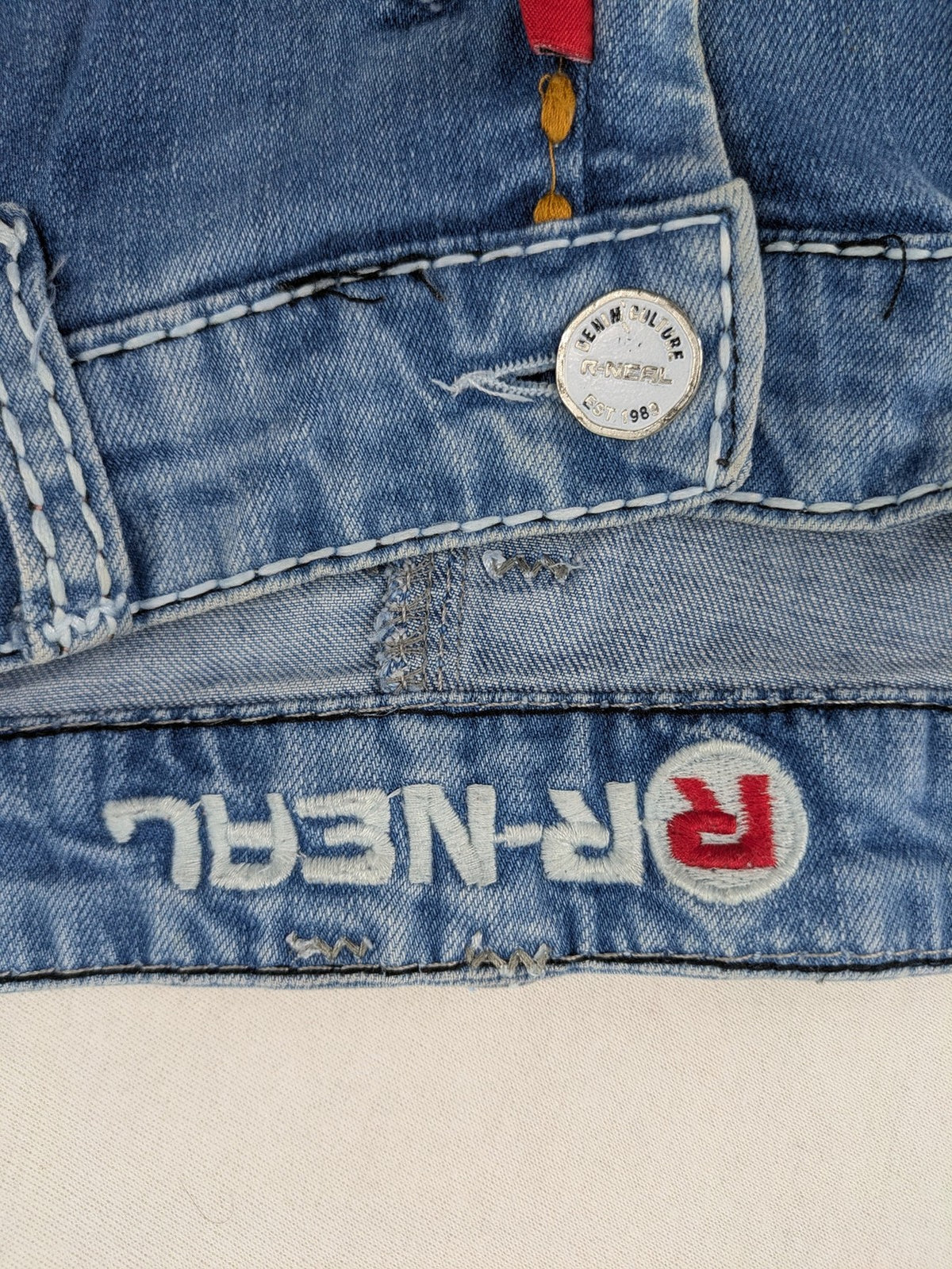 R-Neal blue straight jeans with red-white contrast stitching and classic 5-pocket design.