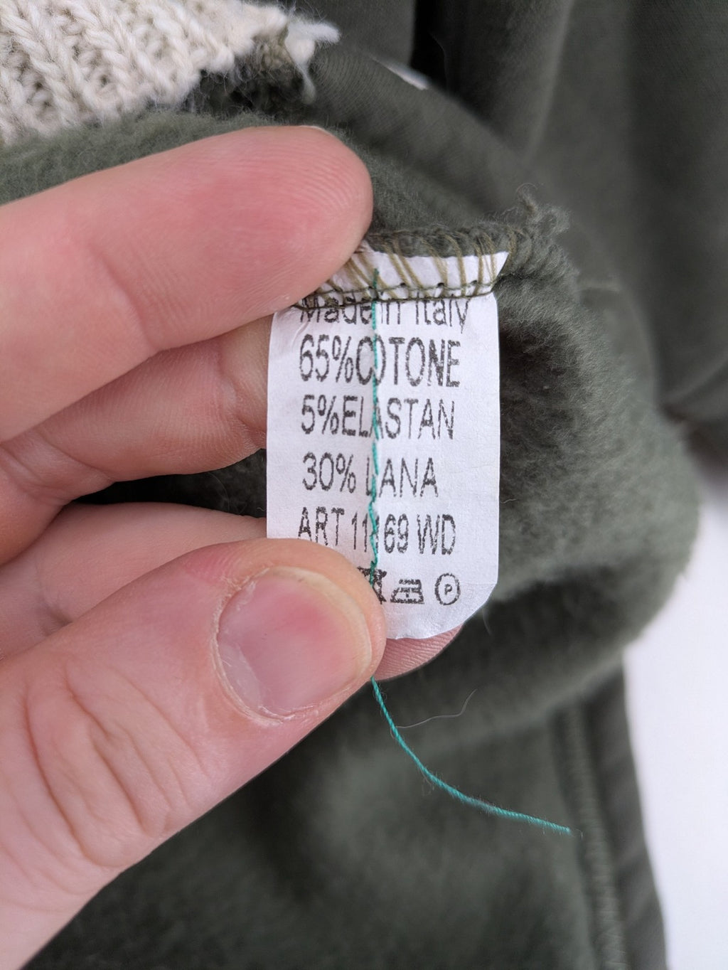DCJ cream and olive green hoodie with cable knit pattern and graphic text sleeves.