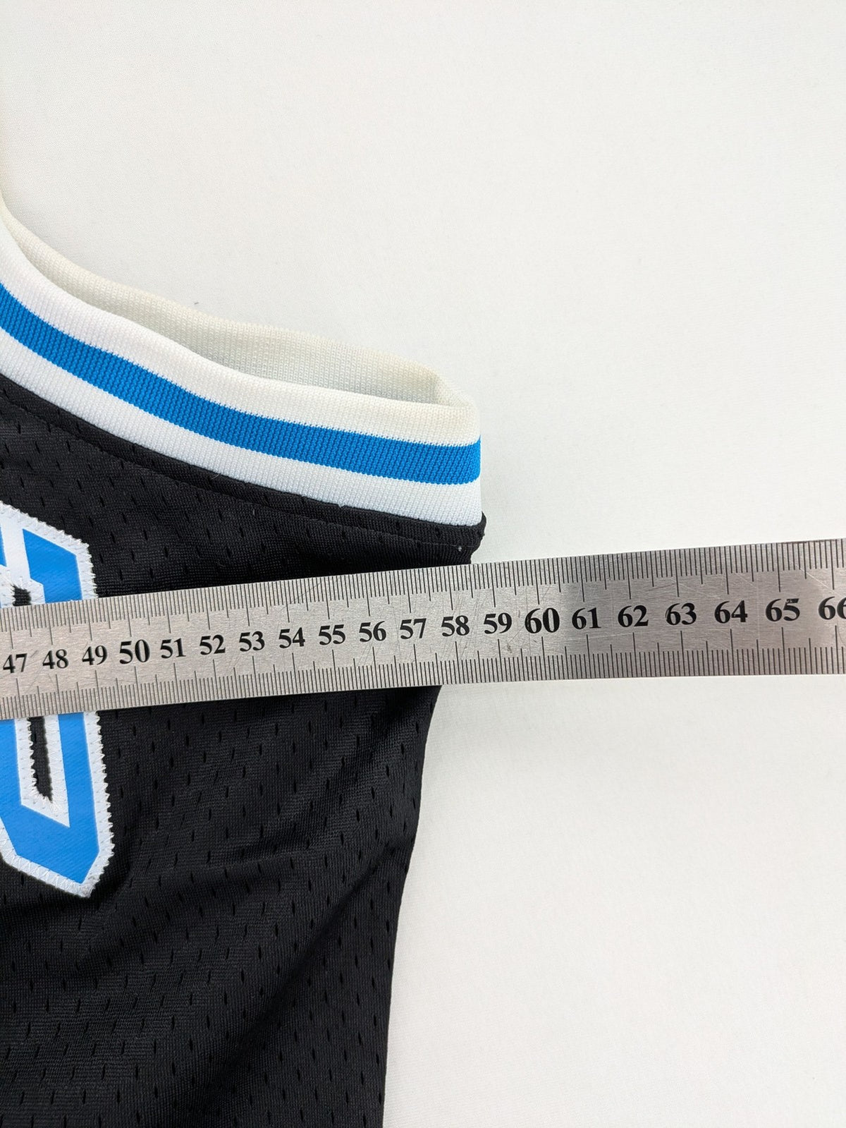 Friends With Money blue basketball jersey black mesh with stylized graphic and number "1