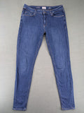 Q/S blue superslim fit jeans with classic 5-pocket style and zipper detail.