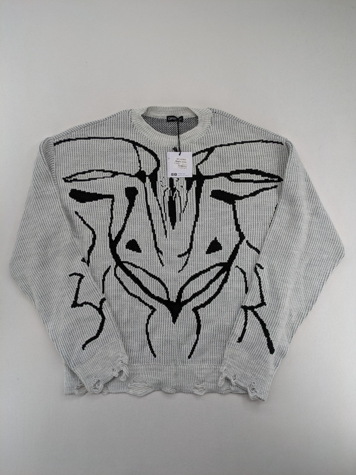 Drizzle turtle neck jumper black grey with abstract graphic print and distressed details.