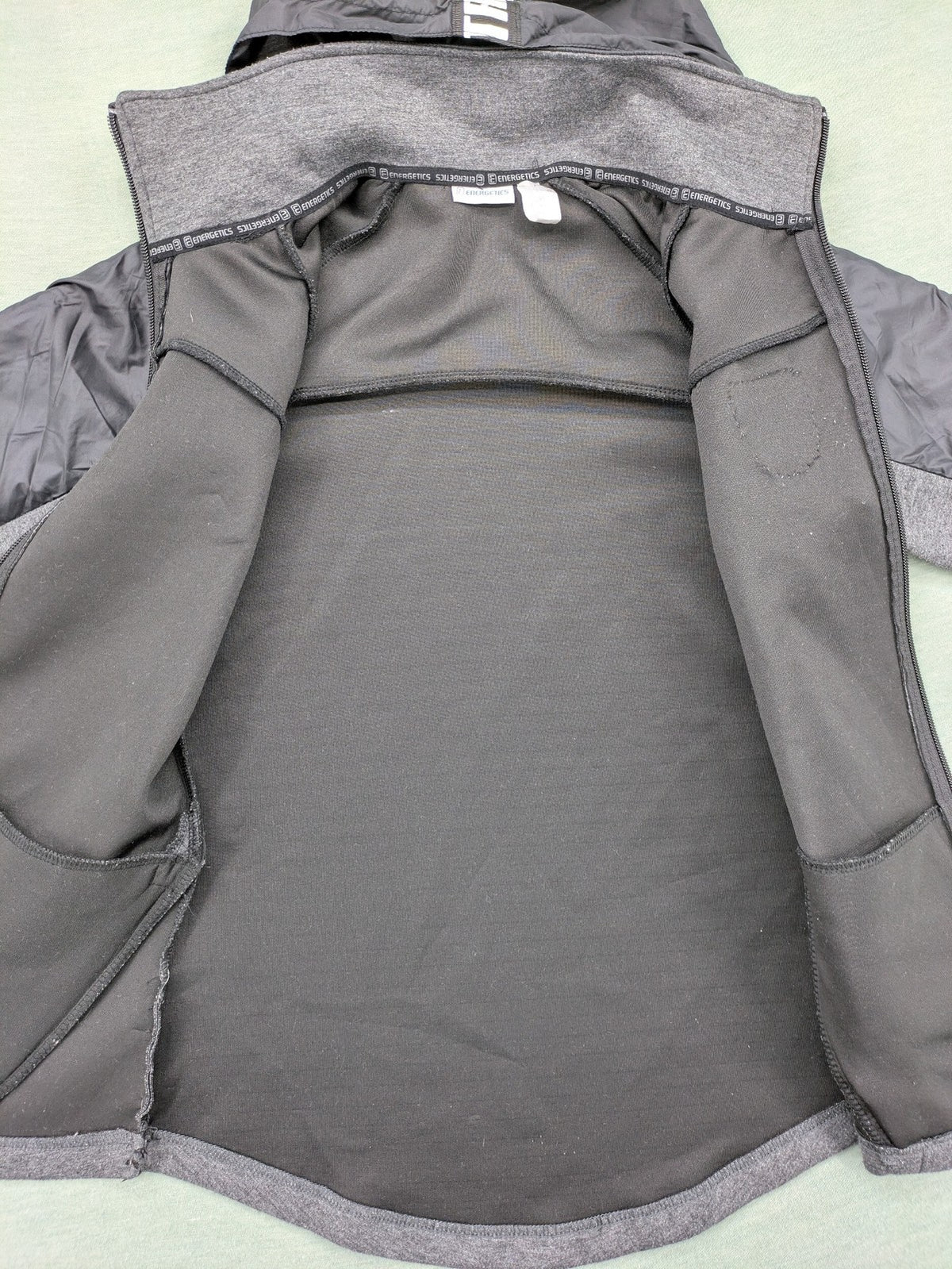 Energetics hybrid jacket black grey with High Peak patch and zip-up design.