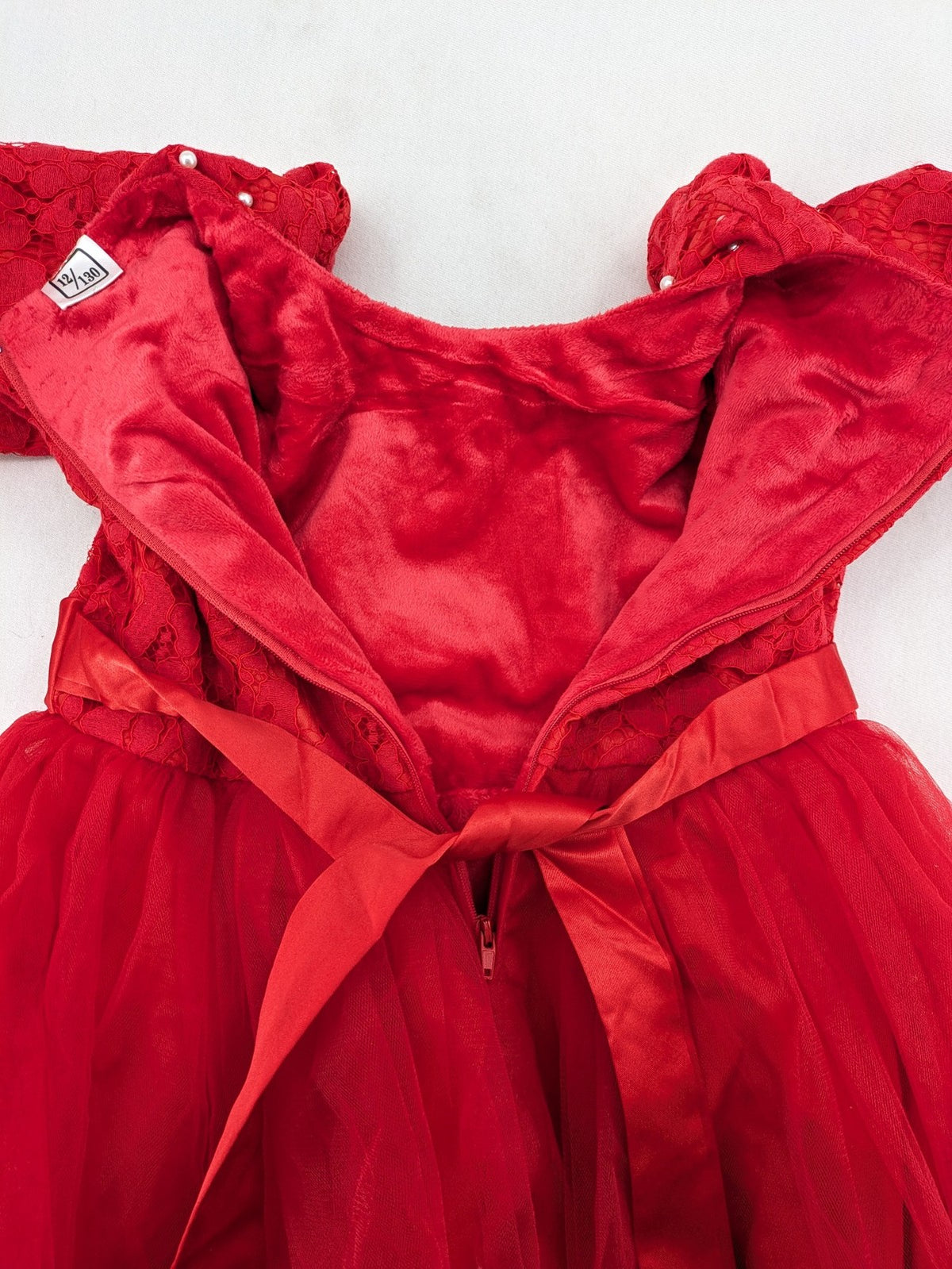 Perfekt red bridal party dress with floral lace bodice and tulle skirt, pearl embellishments.