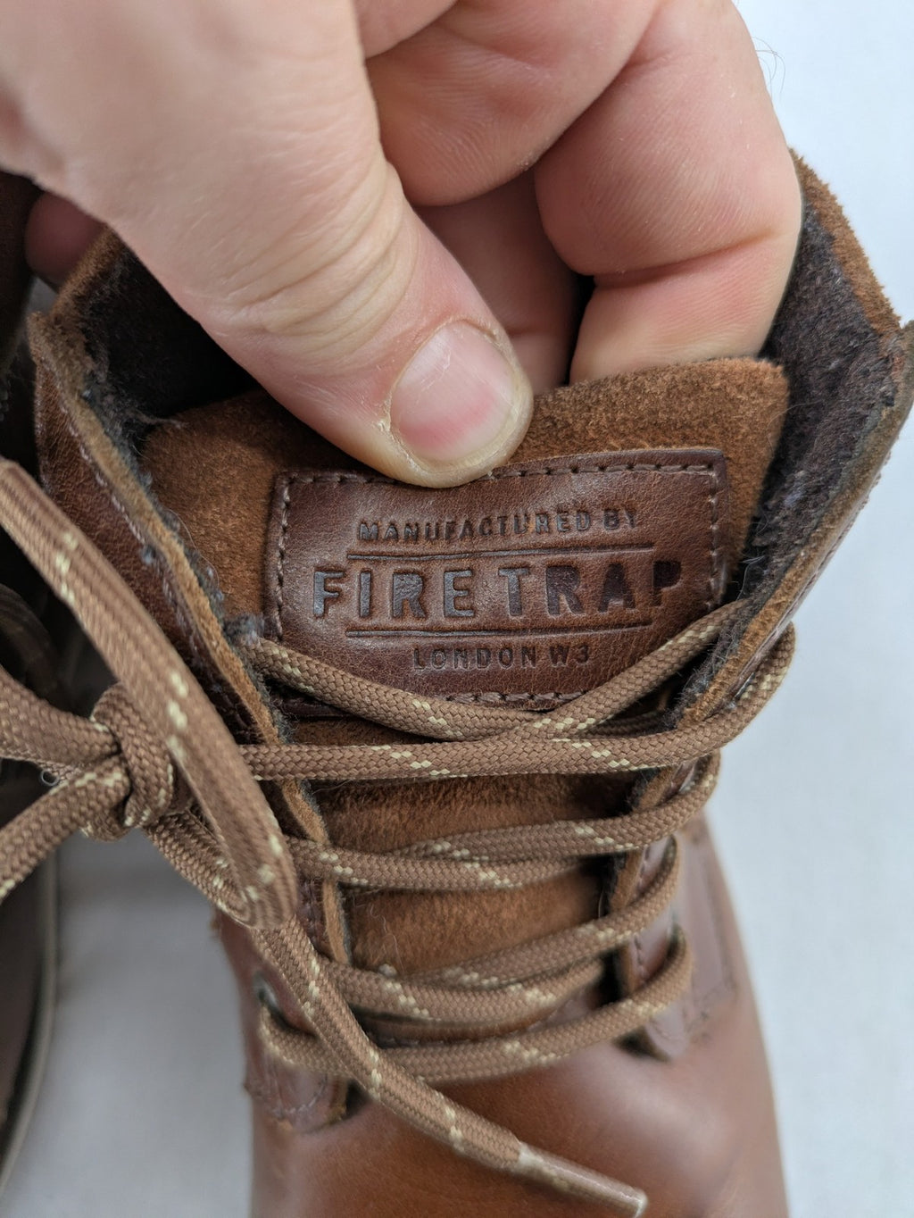 Firetrap brown motorcycle boots with classic lace-up design and padded ankle support.