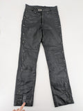 Hein Gericke black leather chaps with studs and wavy decorative seams.