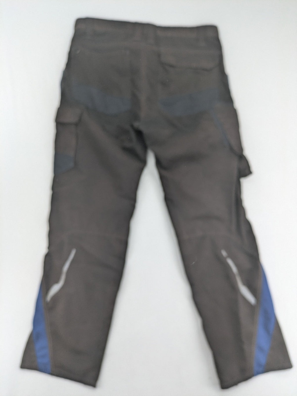 Kübler work pants blue grey Cordura fabric with multiple cargo pockets and reflective details.