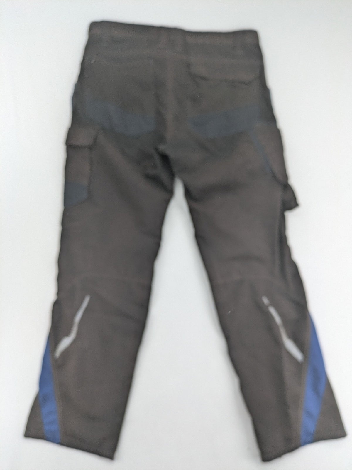 Kübler work pants blue grey Cordura fabric with multiple cargo pockets and reflective details.