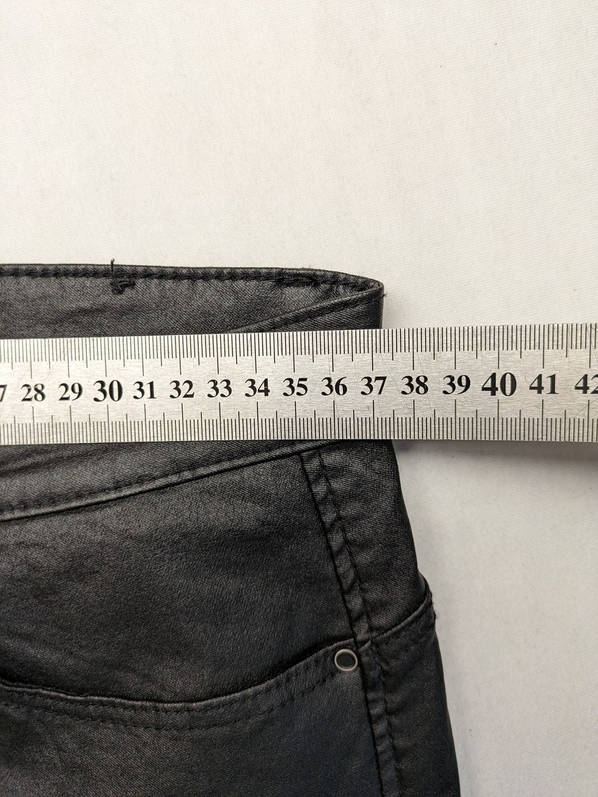 Stradivarius black coated straight jeans with leather-like finish and stretchy material.