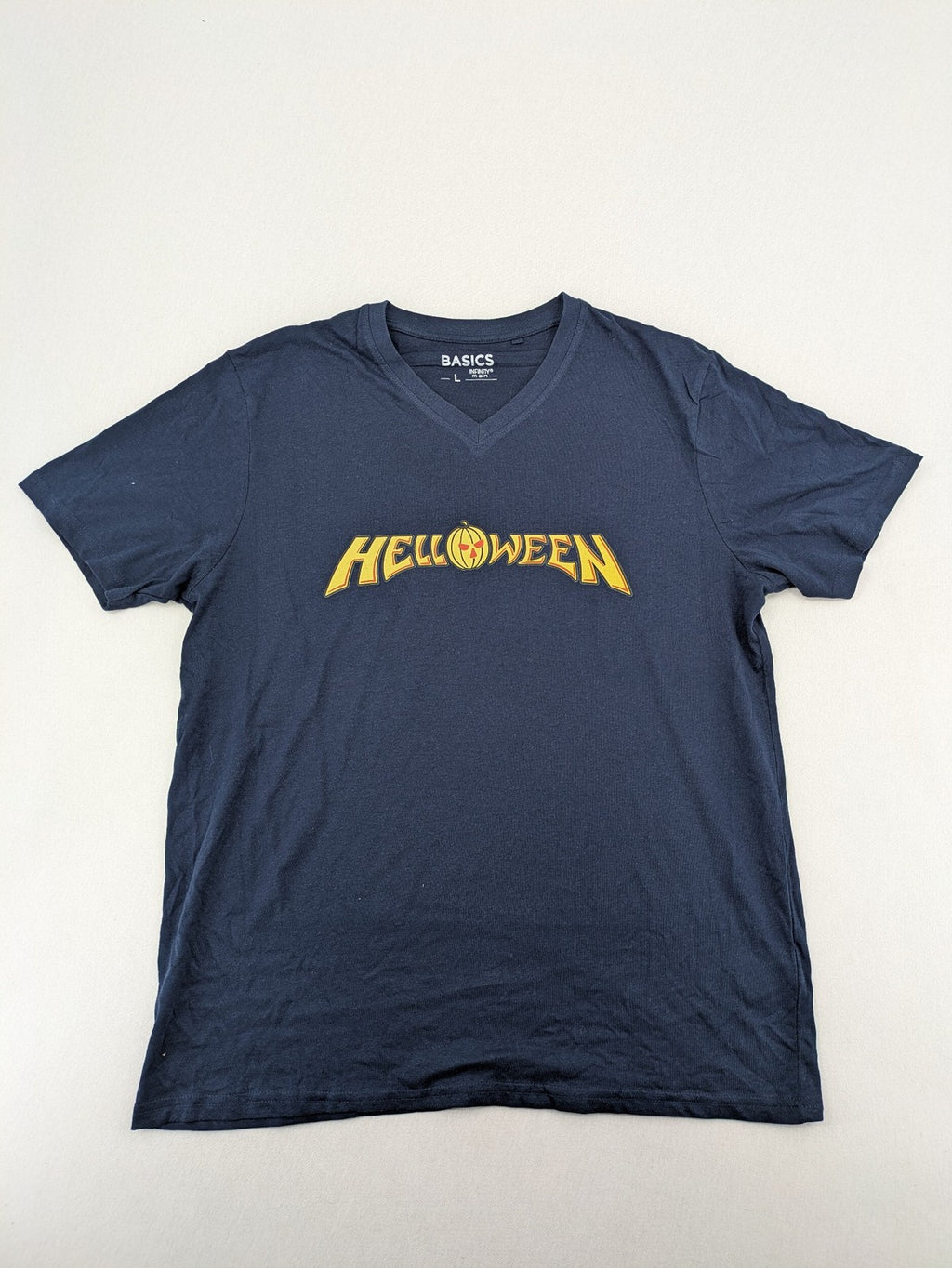 Helloween navy band T-shirt featuring iconic logo and pumpkin graphic, cotton material.
