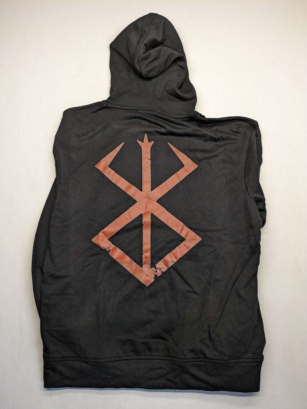 Berserk grey hoodie with pink "Brand of Sacrifice" symbol on front and back.