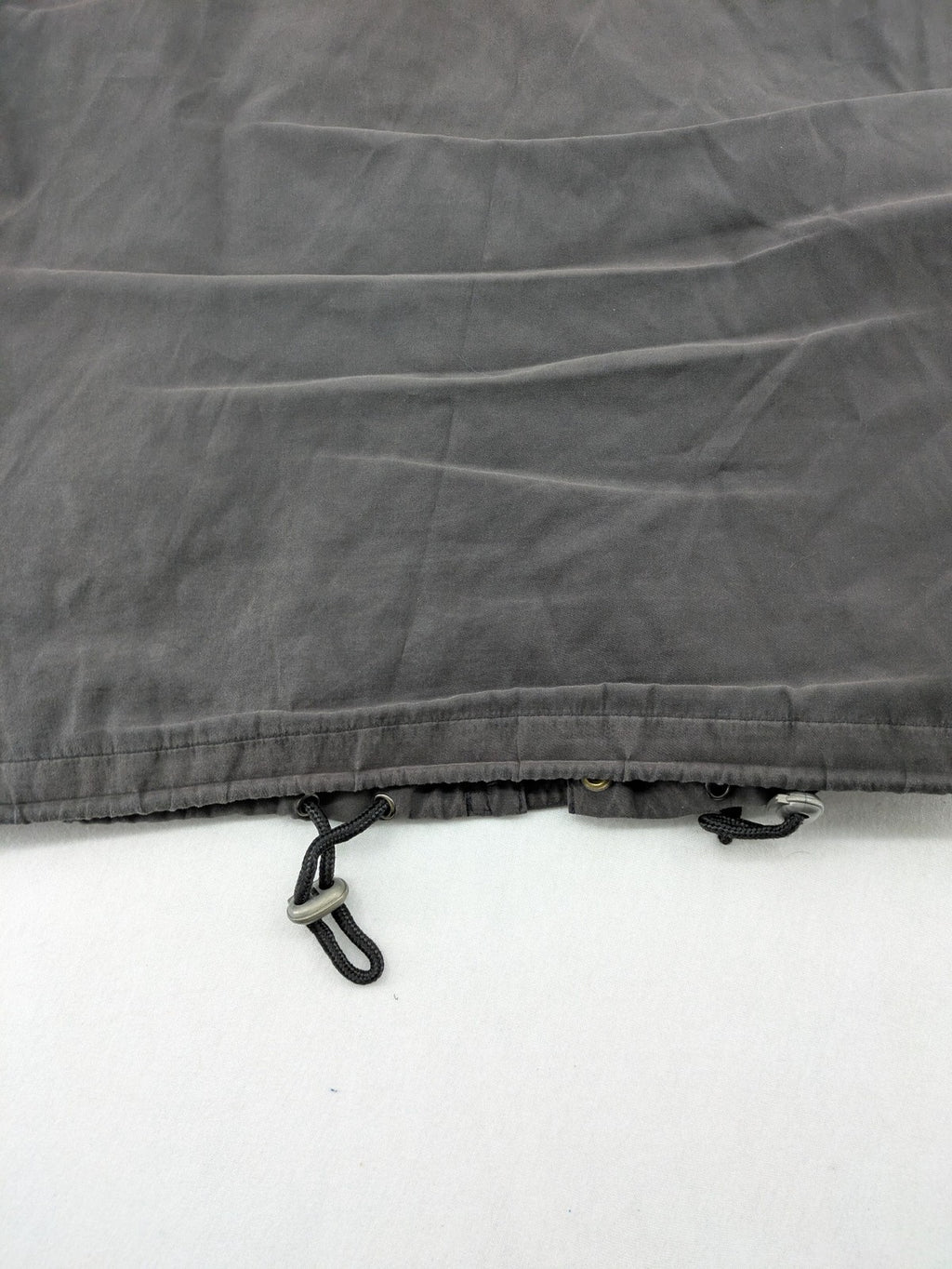 Barisal grey coat with hood, cargo pockets, and checkered lining detail.