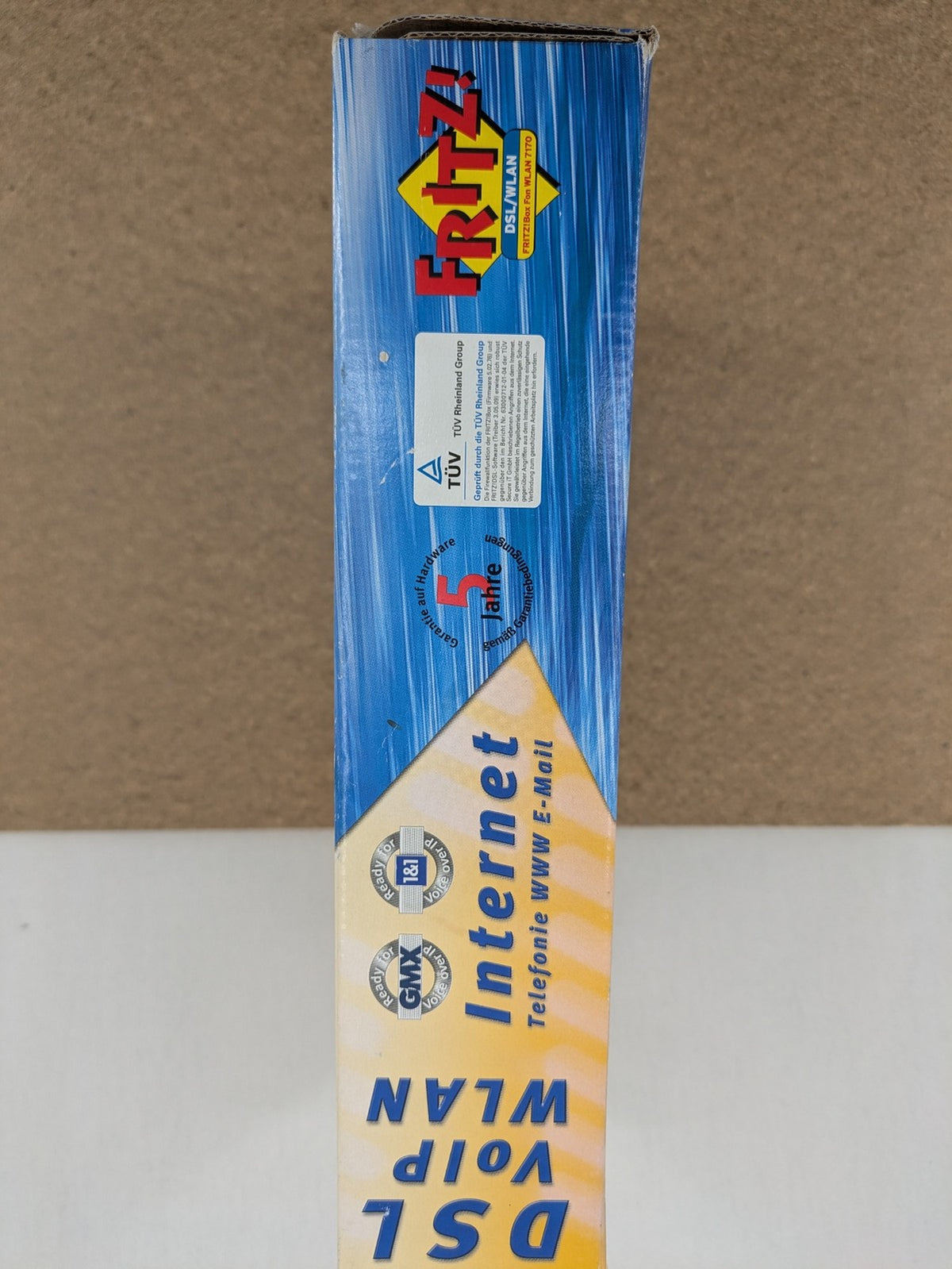 AVM wireless router black grey yellow with logo and integrated DSL modem features.