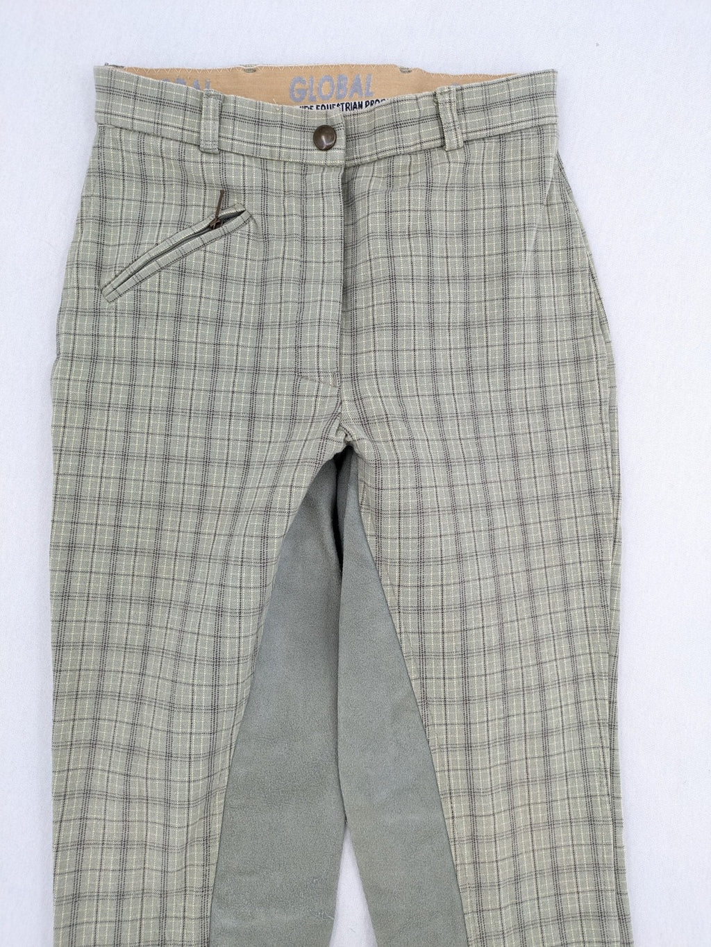 Jodhpur beige and grey riding pants with green check pattern and knee patches.
