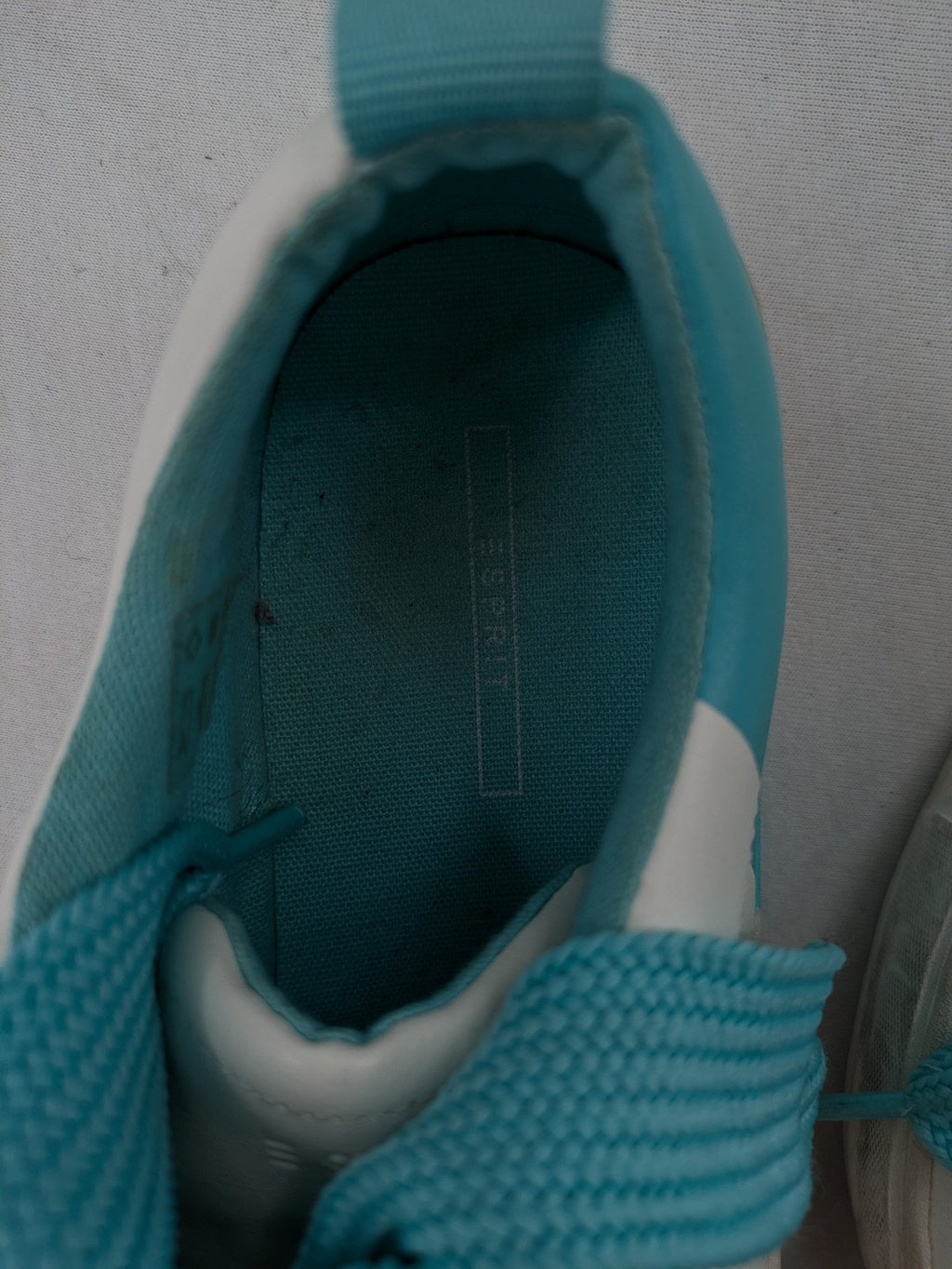 Esprit women's sneakers white with turquoise accents and wide laces.