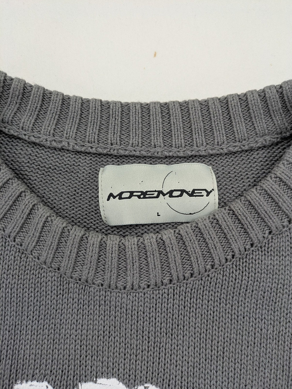MOREMONEY grey turtle neck jumper with white abstract graphic print and relaxed fit.