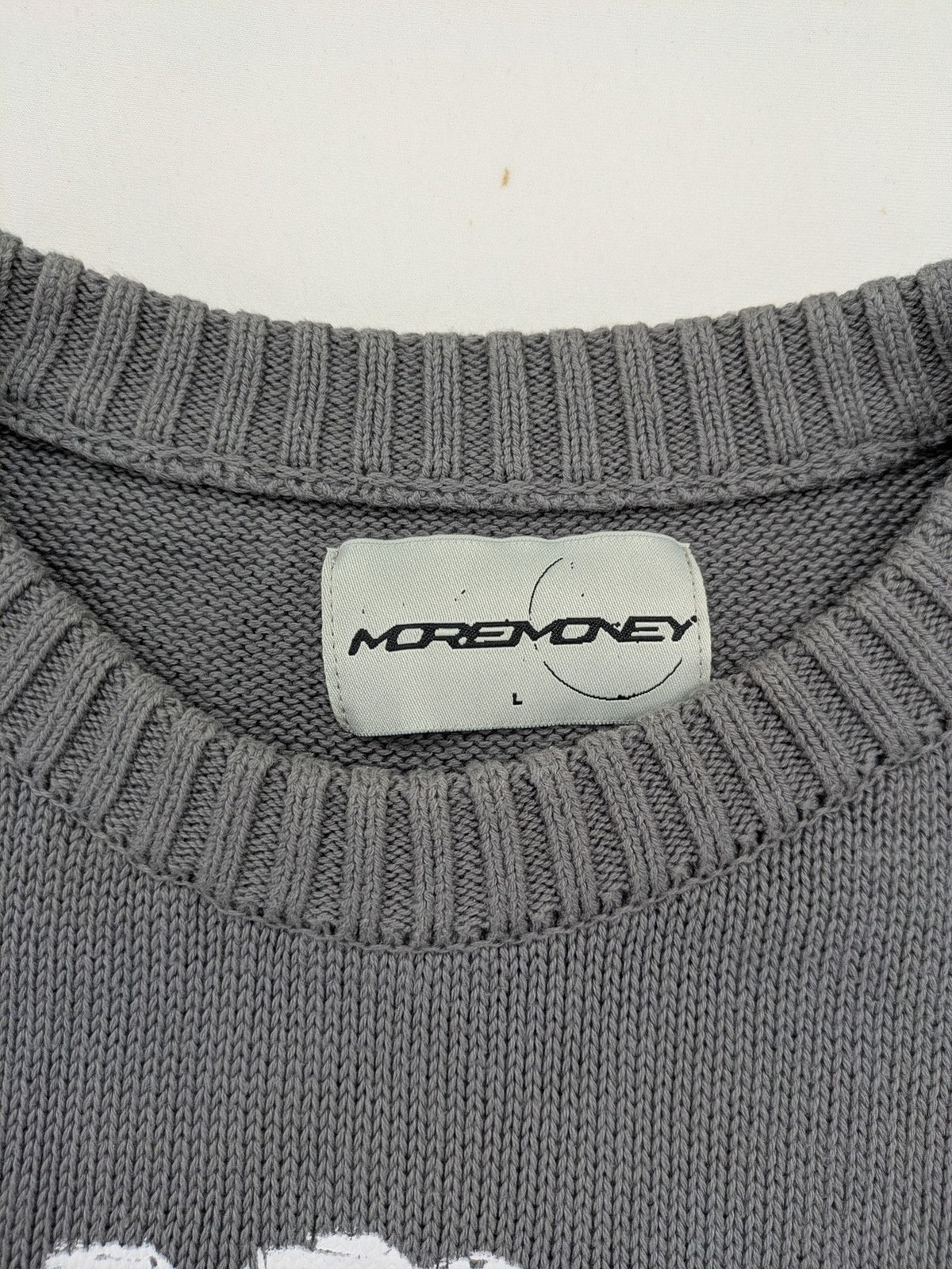 MOREMONEY grey turtle neck jumper with white abstract graphic print and relaxed fit.