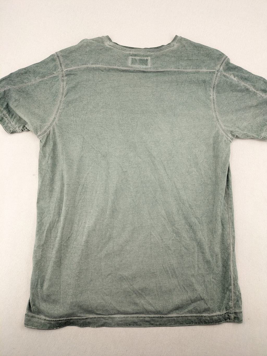 Camel Active green t-shirt with striped chest pocket and used look cotton fabric.