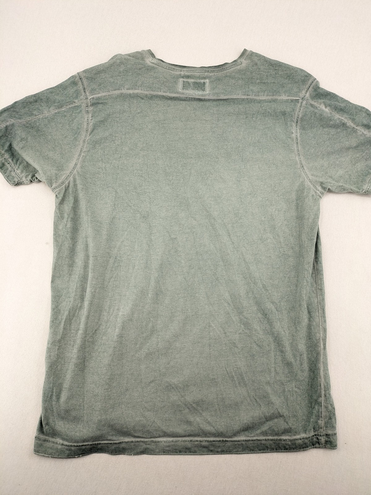 Camel Active green t-shirt with striped chest pocket and used look cotton fabric.