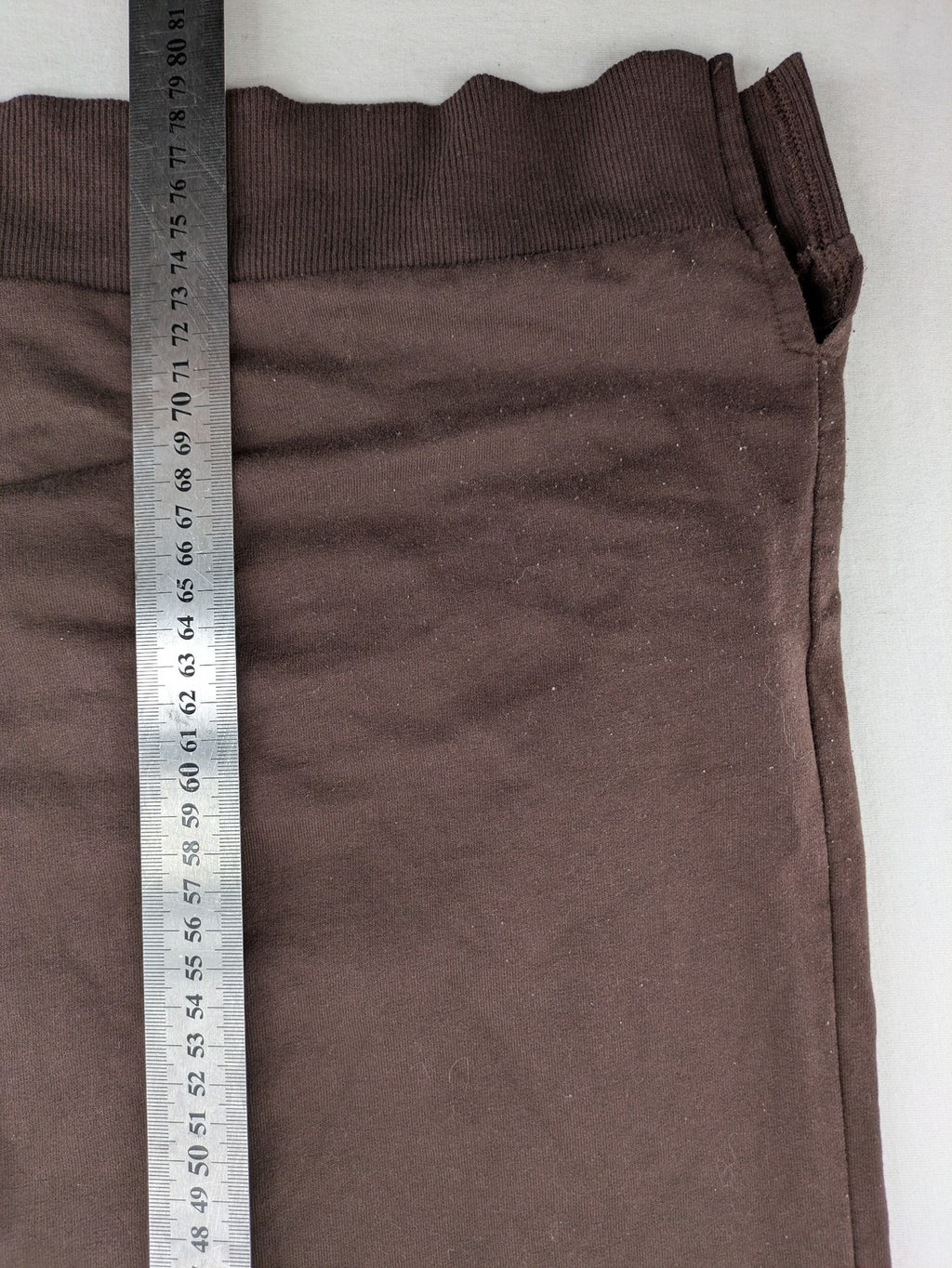 LC Waikiki green sweatshirt dress with minimalist white line art graphic and ribbed cuffs.