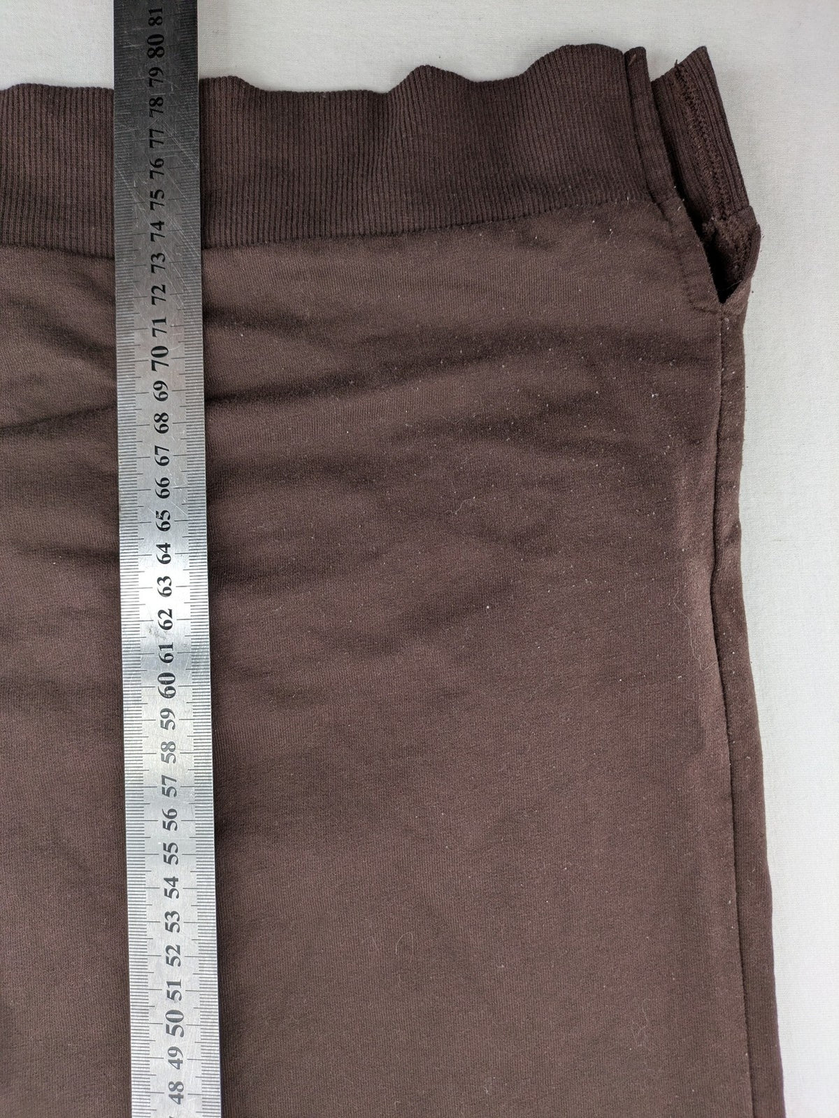 LC Waikiki green sweatshirt dress with minimalist white line art graphic and ribbed cuffs.