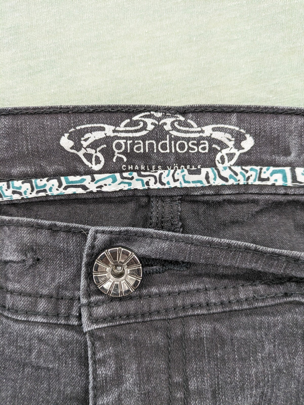 Charles Vögele grey straight jeans with elastic waistband and decorative studs on pockets.