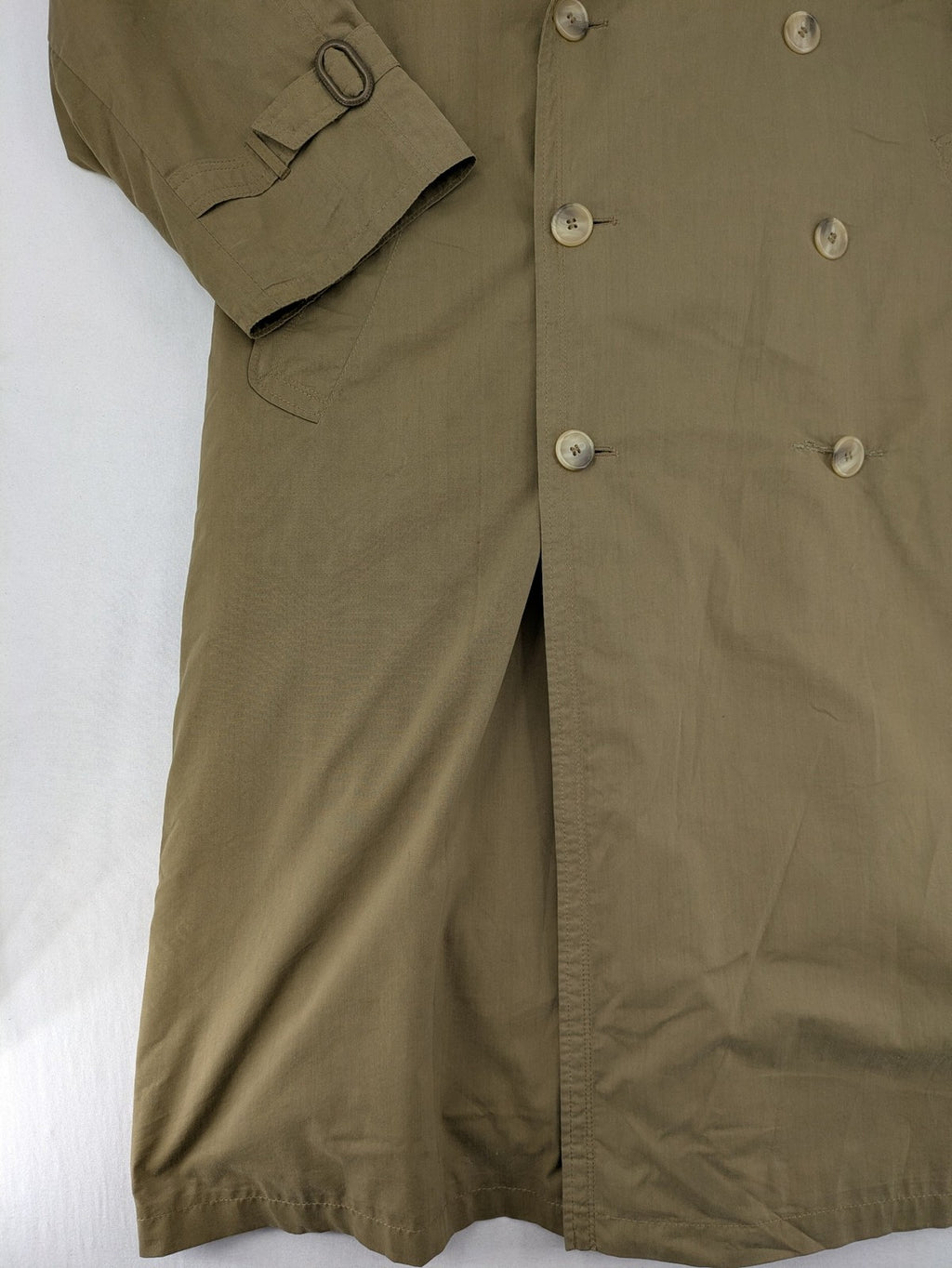 Studio Novum khaki trench coat double-breasted design with belt and wool lining.