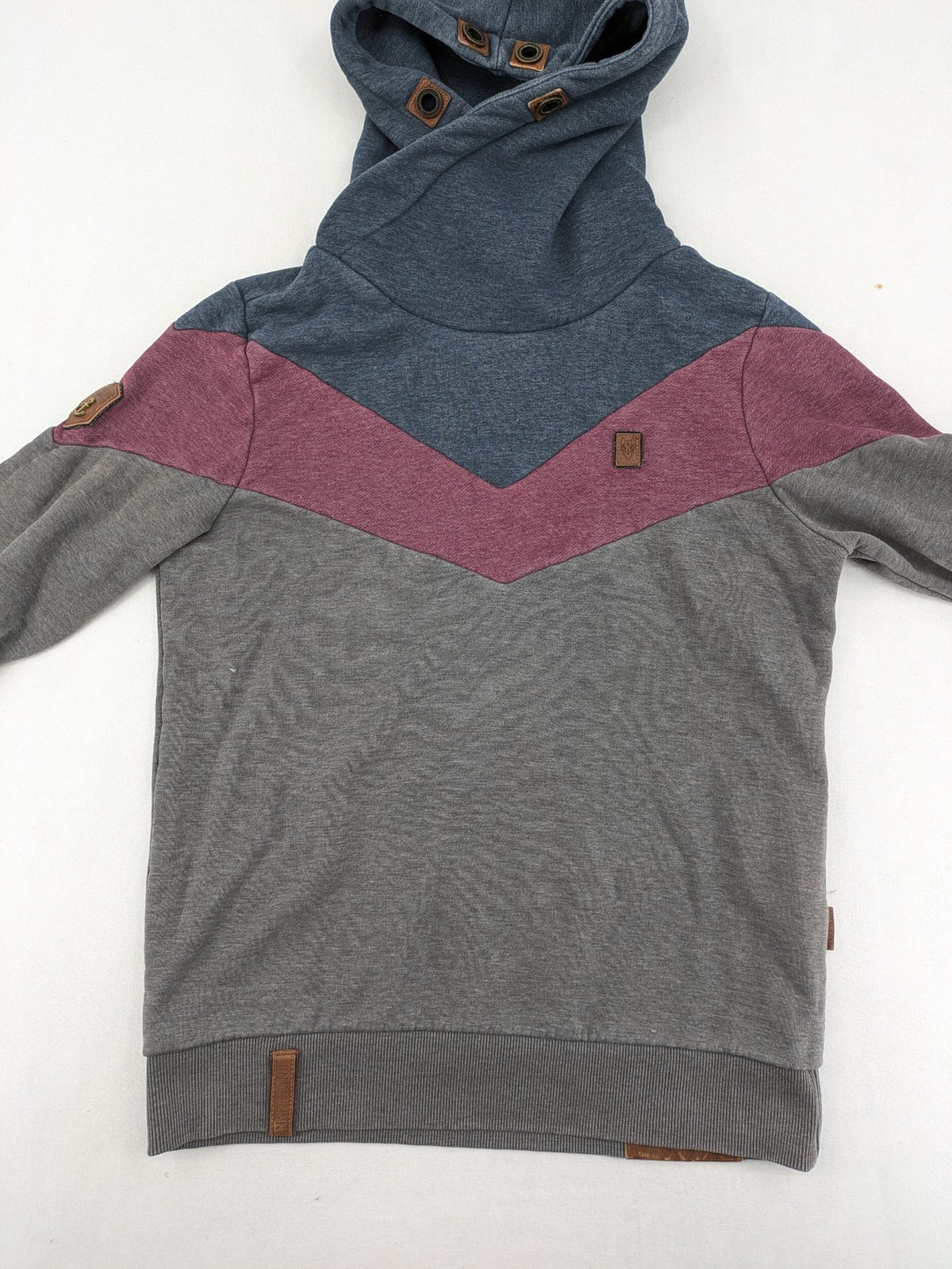 Naketano multicolor turtle neck jumper with button placket and anchor patches.