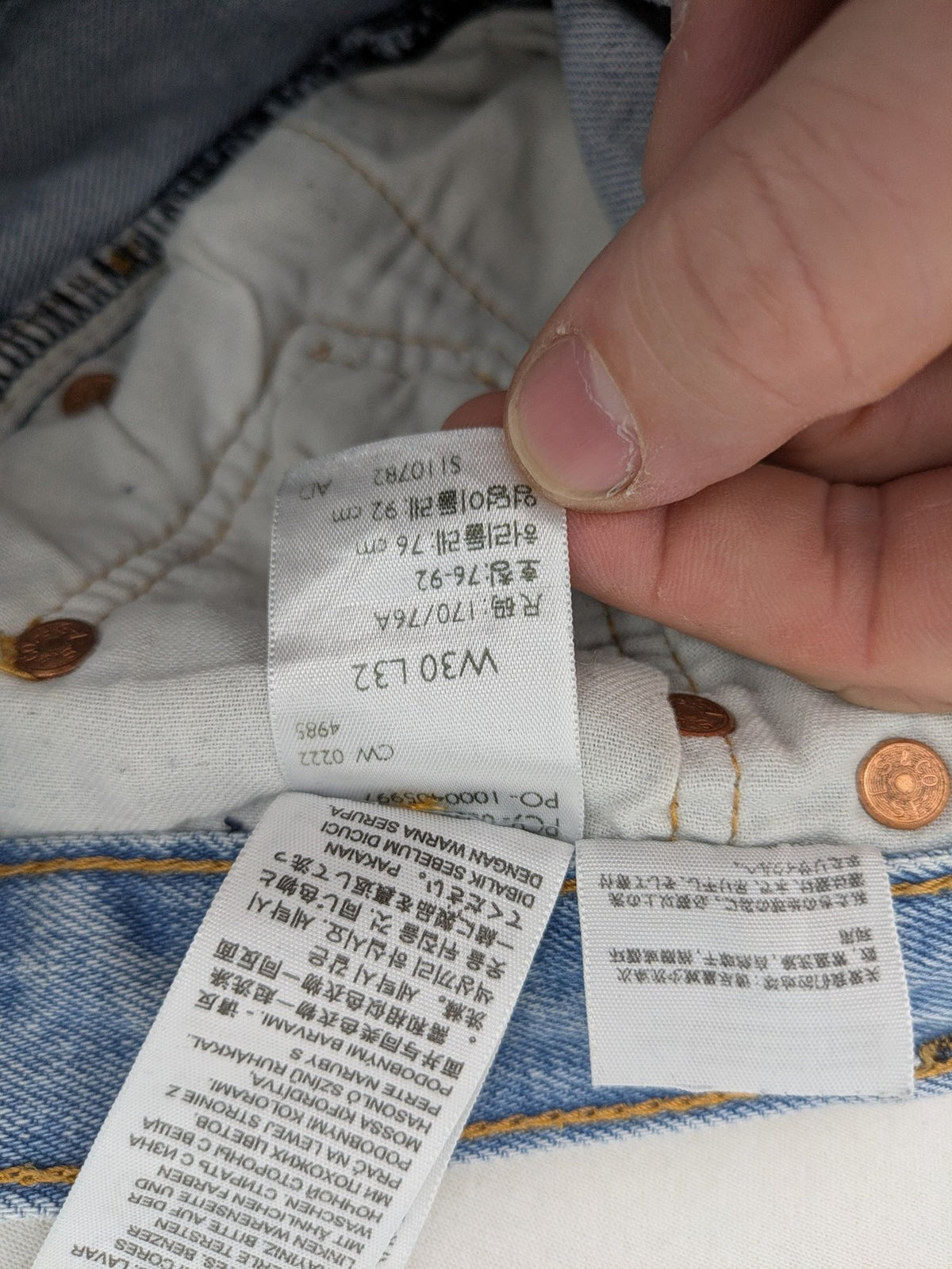 Levi's blue straight jeans light wash denim with button fly and classic fit.
