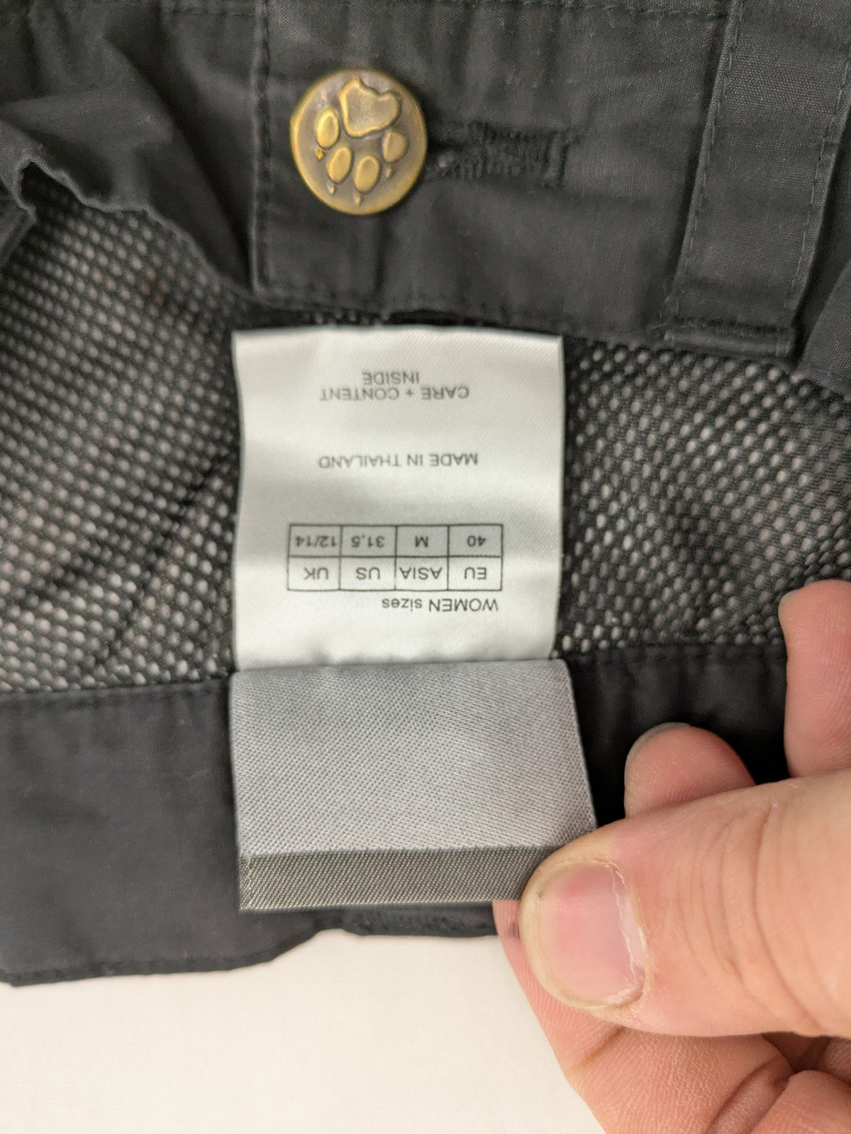 Jack Wolfskin grey outdoor pants with embroidered logo and side zip pocket.